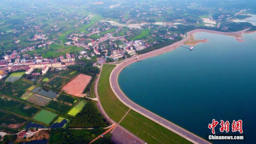 A view of the Weishui Reservoir in Songzi City, Central China’s Hubei Province. The S-shaped reservoir dam is 8,968 meters long and said to be the longest earth-filled man-made dam in Asia. The reservoir contains hundreds of islands, making it a top tourist attraction, and it is also home to a leading camping site. (Photo: China News Service/Zhou Xingliang)