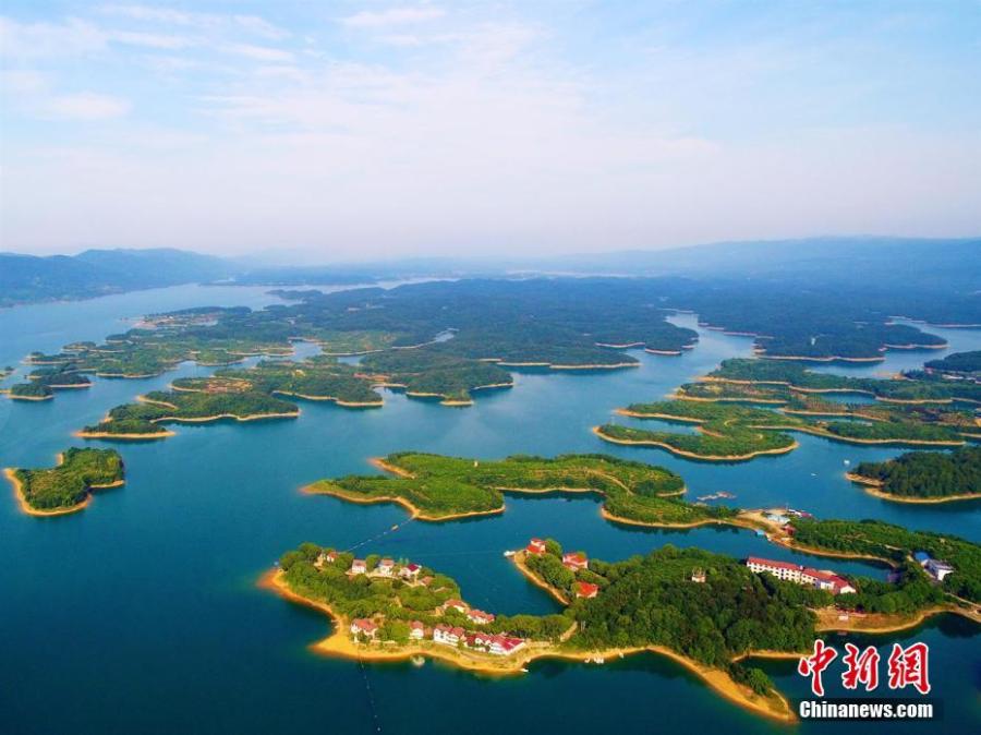 A view of the Weishui Reservoir in Songzi City, Central China’s Hubei Province. The S-shaped reservoir dam is 8,968 meters long and said to be the longest earth-filled man-made dam in Asia. The reservoir contains hundreds of islands, making it a top tourist attraction, and it is also home to a leading camping site. (Photo: China News Service/Zhou Xingliang)