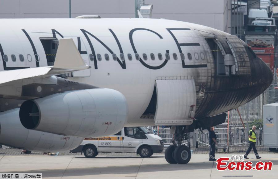 A plane of the Star Alliance is damaged after a push-car caught fire at the airport in Frankfurt, Germany, June 11, 2018. German airline Lufthansa says 10 airport workers have suffered minor injuries from smoke inhalation when a vehicle pulling a jet to a gate caught on fire. (Photo/Agencies)