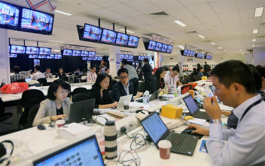 Reporters work at the international media center in Singapore, ahead of the historic summit between top leader of the Democratic People\'s Republic of Korea (DPRK) Kim Jong Un and U.S. President Donald Trump, on June 12, 2018. (Xinhua/Li Peng)