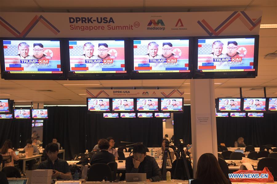 Members of the press work at the international media center in Singapore, June 10, 2018. The much-anticipated meeting between U.S. President Donald Trump and Kim Jong Un, top leader of the Democratic People\'s Republic of Korea (DPRK) is to start here on Tuesday. (Xinhua/Then Chih Wey)