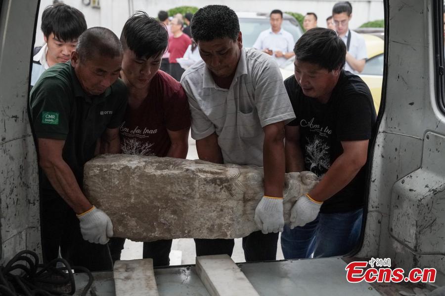 Four white marble building pieces are transported from the Qinghe Sub-district Administration Office in Haidian District, Beijing to the Older Summer Palace for preservation, June 12, 2018. The four cultural relics were found at a construction site in 2017, and experts believe they were originally part of buildings in the Old Summer Palace, a garden for the royal family during the Qing Dynasty (1644-1911) that was known as the \