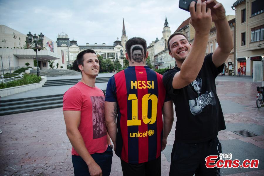 A fan of Lionel Messi shows his new haircut that features the face of the football star in Novi Sad, Serbia ahead of the World Cup. Barber Mario Hvala is famed for his salon in Novi Sad, where he shaves all manner of shapes and faces into customers\' hair. (Photo/Agencies)