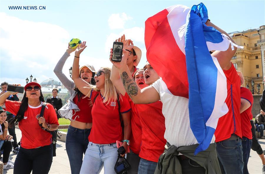 Fans cheer near the Red Square in Moscow, Russia, on June 13, 2018. The 2018 Russia World Cup will kick off on June 14. (Xinhua/Yang Lei)