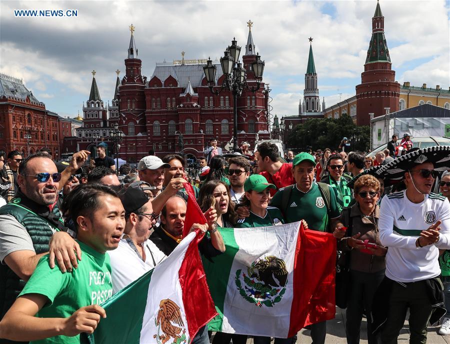 Fans of Mexico\'s team pose for photos near the Red Square in Moscow, Russia, on June 13, 2018. The 2018 Russia World Cup will kick off on June 14. (Xinhua/Yang Lei)