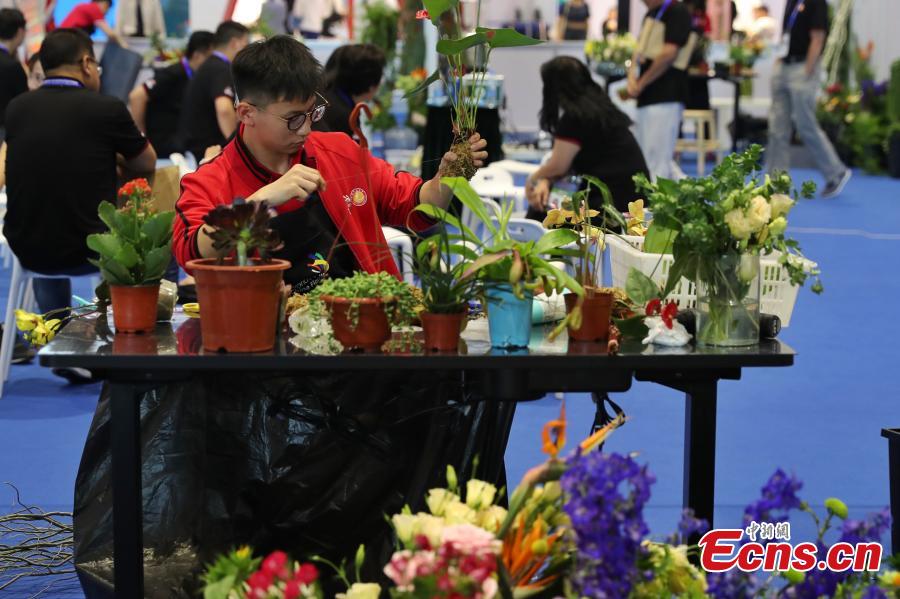 A scene from the WorldSkills China National Competition in Shanghai, June 13, 2018. A total of 897 skilled professionals from across the country will compete in 34 programs including carpentry, floriculture, gem cutting, baking and panel beating. The winners will represent China at the 46th WorldSkills Competition in 2021. WorldSkills aims to raise the profile and recognition of skilled people and show how important skills are in achieving economic growth and personal success, according to its official website. (Photo: China News Service/Zhang Hengwei)