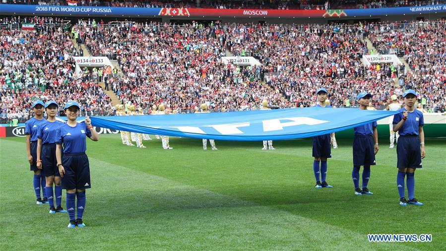 <?php echo strip_tags(addslashes(Chinese caddies enter into the field holding a FIFA flag before the opening match of the 2018 FIFA World Cup in Moscow, Russia, on June 14, 2018. (Xinhua/Yang Lei))) ?>