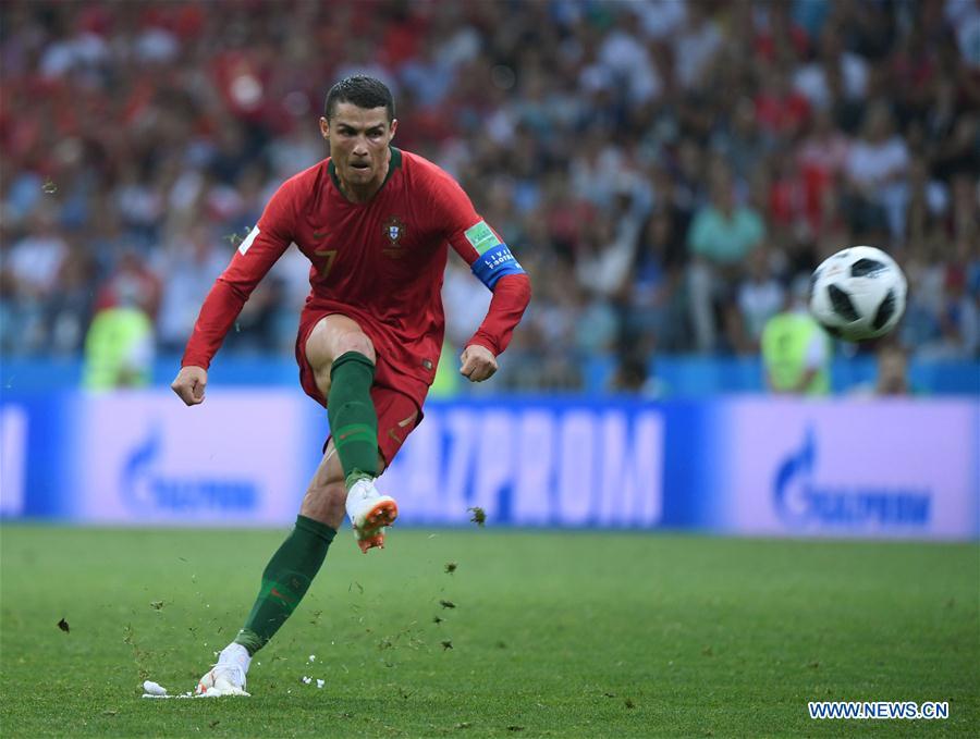 Portugal\'s Cristiano Ronaldo scores a free kick during a group B match between Portugal and Spain at the 2018 FIFA World Cup in Sochi, Russia, June 15, 2018. The match ended in a 3-3 draw. (Xinhua/Li Ga)