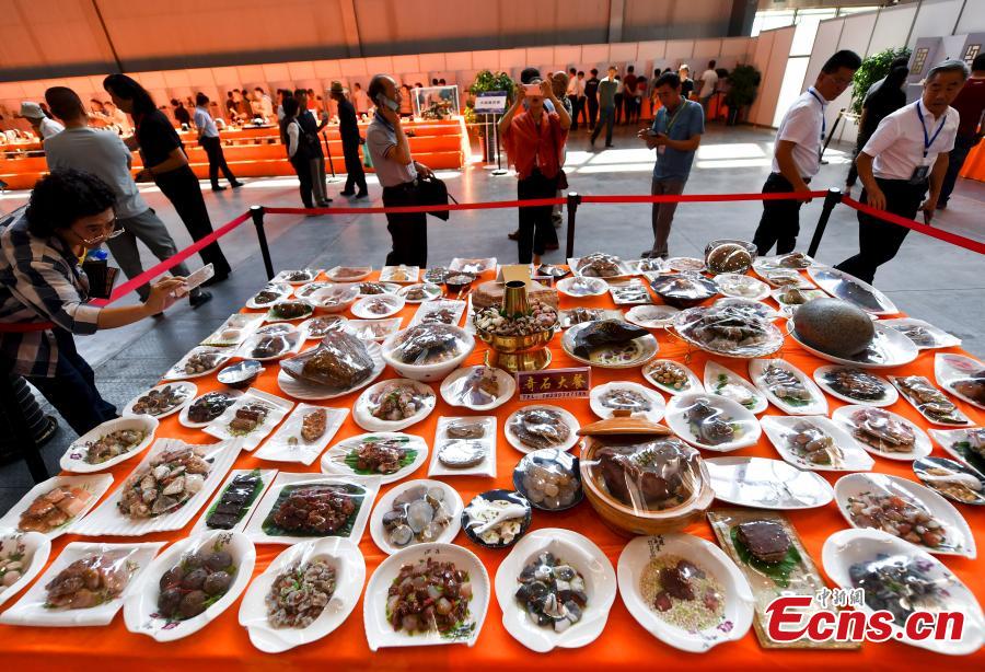 A stone banquet made of rare stones is on display at an exhibition center in Urumqi, capital of northwest China\'s Xinjiang Uygur Autonomous Region, June 15, 2018. (Photo: China News Service/Liu Xin)
