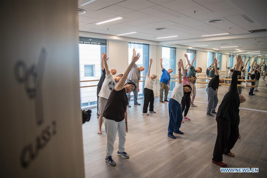 Israelis learn Tai Chi at the Chinese Cultural Center in Tel Aviv, Israel, on June 18, 2018. The Chinese Cultural Center provides locals with a series of courses introducing Chinese culture. (Xinhua/Guo Yu)