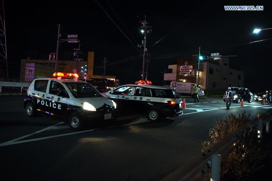 <?php echo strip_tags(addslashes(Policemen lead vehicles away at a site of a damaged road in Osaka, Japan, on June 18, 2018. At least three people have been confirmed dead and more than 90 others injured as a result of a 6.1 magnitude earthquake striking Osaka prefecture in western Japan on Monday morning. (Xinhua/Ma Ping))) ?>