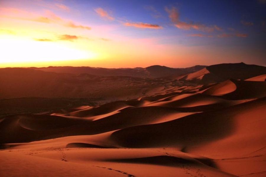 <?php echo strip_tags(addslashes(Scenery from the Badain Jaran desert in Alshaa league, North China's Inner Mongolia autonomous region. Sapphire-blue lakes coexist with high and low sand hills, presenting an interesting blend of barren and lush landscapes. (Photo/China Daily))) ?>