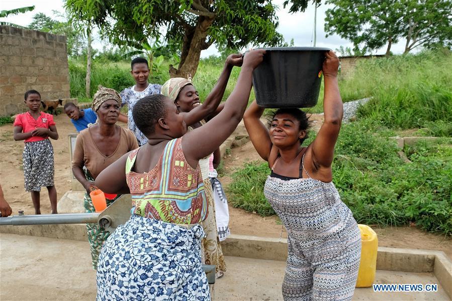 Women fetch water from a borehole in Agyakwa Village, Eastern Region, Ghana, on June 18, 2018. The government of China is providing 1,000 boreholes for hundreds of rural communities in six out of the ten regions of Ghana to bring clean water to the people. (Xinhua/Zhao Shuting)