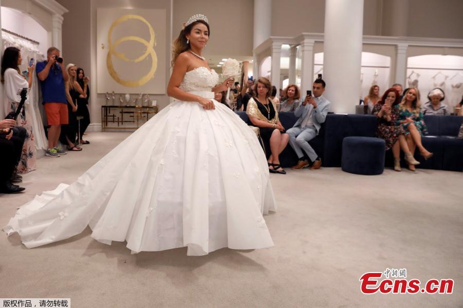A model presents her wedding gown during the 14th Annual Toilet Paper Wedding Dress Contest in Manhattan, New York, U.S., June 20, 2018. (Photo/Agencies)