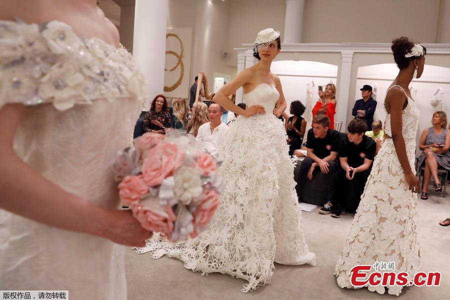 Models present their wedding gowns during the 14th Annual Toilet Paper Wedding Dress Contest in Manhattan, New York, U.S., June 20, 2018. (Photo/Agencies)