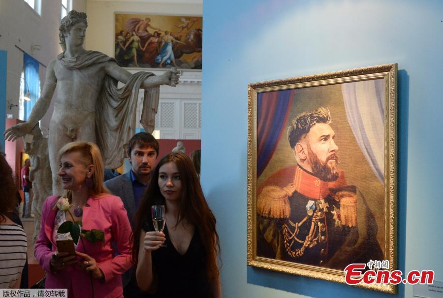 A portrait of Argentina’s forward Lionel Messi is on display during the opening of the Art Project \'Like the Gods\', presented by the Museum of the Russian Academy of Arts and Italian artist Fabrizio Birimbelli during the Russia 2018 World Cup in Saint Petersburg, on June 20, 2018. The project presents a series of portraits of world football stars and coaches in historical uniforms and includes more than 40 portraits. (Photo/Agencies)