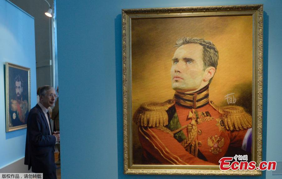 A portrait of Russia\'s football player Roman Shirokov is on display during the opening of the Art Project \'Like the Gods\', presented by the Museum of the Russian Academy of Arts and Italian artist Fabrizio Birimbelli during the Russia 2018 World Cup in Saint Petersburg, on June 20, 2018. The project presents a series of portraits of world football stars and coaches in historical uniforms and includes more than 40 portraits. (Photo/Agencies)