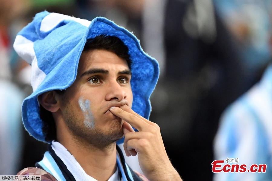 An Argentina fan looks dejected after the match between Argentina and Croatia in Nizhny Novgorod Stadium, Nizhny Novgorod, Russia, June 21, 2018. Croatia stunned Argentina 3-0 to advance to the group stage of the World Cup. (Photo/Agencies)