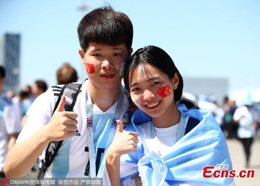 <?php echo strip_tags(addslashes(Chinese fans are seen in Russia to cheer for their favorite team at the 2018 FIFA World Cup. (Photo/Osports))) ?>