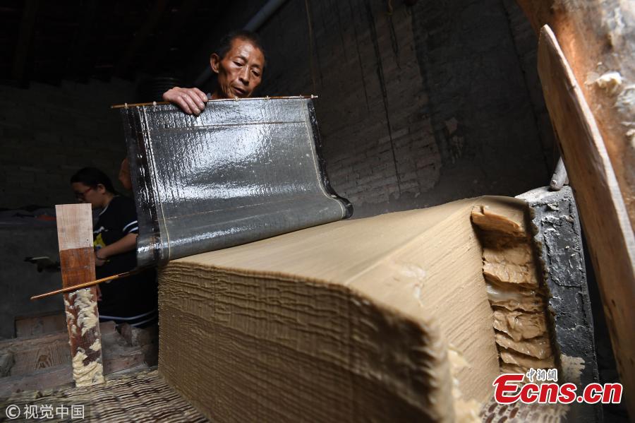 Huang Shiguo, 65, makes paper using ancient methods in his home in Baishui Village, Qiandongnan Miao and Dong Autonomous Prefecture, Southwest China’s Guizhou Province. Huang said he began learning the traditional paper-making craft at 29 and has been dedicated to the ancient craft ever since. Locals in the area have a more than 1,000-year history of paper making as the region is rich in Yangshan Bamboo, a main material needed for the craft. Huang said the typical process involves 72 steps and 55 days to produce paper. (Photo/VCG)
