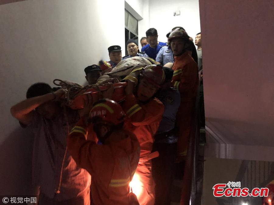 An overweight man is helped to move out of his family home on the third floor of a building in Nanjing, East China’s Jiangsu Province. The man, who has weighed as much as 175 kilograms at a previous weigh-in, has stayed in his home for two years without going out, according to his father. He was injured in a fall. It took professional rescuers three hours to assist medical staff and transfer him to a hospital. (Photo/VCG)