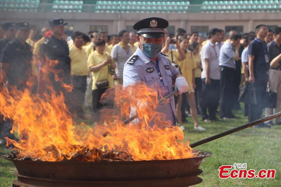 Police burn 297 kilograms of seized heroin, methamphetamine, morphine and other drugs in an event to mark the upcoming International Day Against Drug Abuse and Illicit Trafficking in Linquan County, East China’s Anhui Province, June 23, 2018. The United Nations\' International Day Against Drug Abuse and Illicit Trafficking falls on June 26 each year. (Photo: China News Service/Zhao Qiang)
