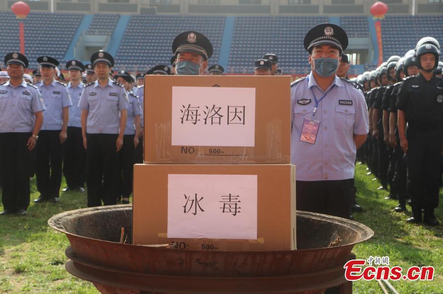 Police burn 297 kilograms of seized heroin, methamphetamine, morphine and other drugs in an event to mark the upcoming International Day Against Drug Abuse and Illicit Trafficking in Linquan County, East China’s Anhui Province, June 23, 2018. The United Nations\' International Day Against Drug Abuse and Illicit Trafficking falls on June 26 each year. (Photo: China News Service/Zhao Qiang)