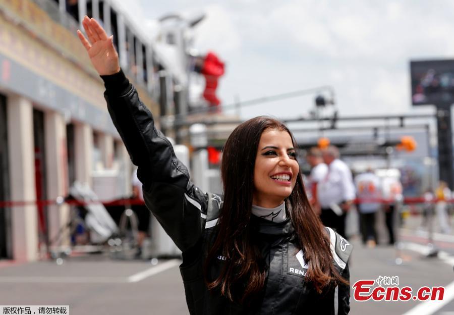 Aseel Al-Hamad of Saudi Arabia poses after driving a Lotus Renault E20 Formula One car during a parade before the French Grand Prix in Circuit Paul Ricard, Le Castellet, France, June 24, 2018. Aseel Al-Hamad drove in front of thousands of fans on Sunday and declared the start of a new era for Saudi women in motorsport. “I believe today is not just celebrating the new era of women starting to drive, it’s also the birth of women in motorsport in Saudi Arabia,” she said. (Photo/Agencies)