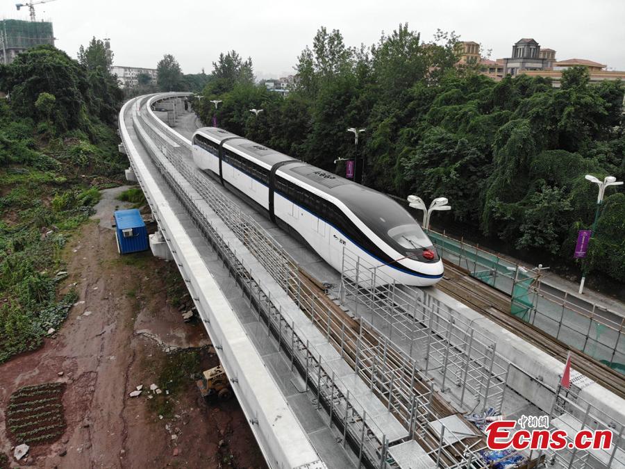 An elevated railway track is under test in Guang’an City, Southwest China’s Sichuan Province. The 8.49-kilometer-long line can transport up to 30,000 people per hour at a maximum speed of 80 kilometers an hour. The system is an effective way to address traffic jams in small and medium-sized cities. The elevated railway track is easier and quicker to build, at a cost of one fourth of building a subway line. (Photo: China News Service/Zhang Lang)