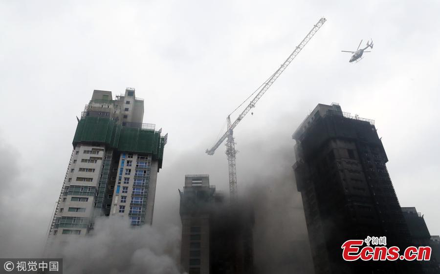 A huge fire engulfs an underground parking garage of an apartment building under construction at the Treeshade apartment construction site in the central administrative city of Sejong, central South Korea, June 26, 2018. The blaze started at 1:10 p.m. local time, leaving at least three dead and 37 others injured.(Photo/VCG)