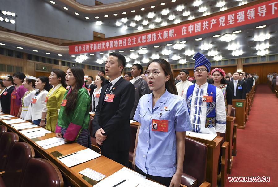 Delegates sing the national anthem at the opening session of the 18th national congress of the Communist Youth League of China (CYLC) in Beijing, capital of China, June 26, 2018. (Xinhua/Yan Yan)