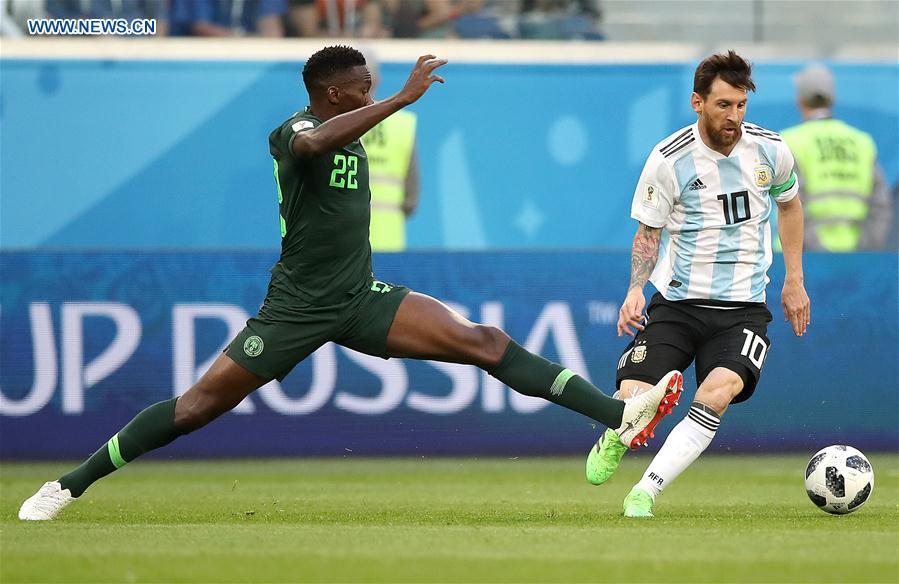 Lionel Messi (R) of Argentina vies with Kenneth Omeruo of Nigeria during the 2018 FIFA World Cup Group D match between Nigeria and Argentina in Saint Petersburg, Russia, June 26, 2018. (Xinhua/Wu Zhuang)