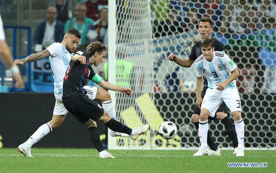 Luka Modric (2nd L) of Croatia shoots to score during the 2018 FIFA World Cup Group D match between Argentina and Croatia in Nizhny Novgorod, Russia, June 21, 2018. Croatia won 3-0. (Xinhua/Wu Zhuang)

Best goal

Yes, Argentina\'s defence has at times been dire in this tournament, but that should take nothing away from Luka Modric\'s spectacular goal for Croatia against the Albiceleste in Nizhny Novgorod. The Real Madrid midfielder dummied onto his left side before daintily shifting back to the right and curling a 30-yard strike into the top right corner, all but securing his team a place in the next stage.