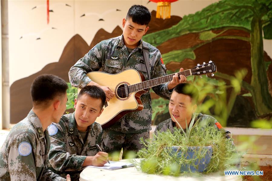 Chinese peacekeepers pratise for their Blue Tone band at the Chinese camp of the UN Multidimensional Integrated Stabilization Mission in Mali, May 12, 2018. In late 2013, China, for the first time, dispatched a security force of 170 soldiers to the UN Multidimensional Integrated Stabilization Mission in Mali (MINUSMA). Among the fifth batch of Chinese peacekeepers of MUNISMA, six soldiers established Blue Tone band in their spare time. On May 12, 2018, the Blue Tone band held a farewell concert before its members returned to China. This year marks the 70th anniversary of UN peacekeeping. China began its participations in the UN peacekeeping operations in 1990. Today, China has some 2,500 peacekeepers and plays an important role in promoting and maintaining world peace. (Xinhua/Han Lijian)
