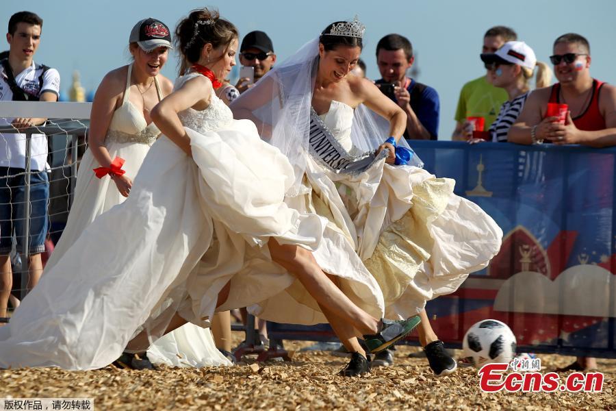 Women wearing wedding dresses take part in the so-called \