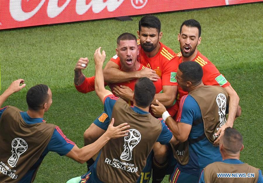 <?php echo strip_tags(addslashes(Players of Spain celebrate after Russia's Sergey Ignashevich scored an own goal during the 2018 FIFA World Cup round of 16 match between Spain and Russia in Moscow, Russia, July 1, 2018. (Xinhua/Wang Yuguo))) ?>