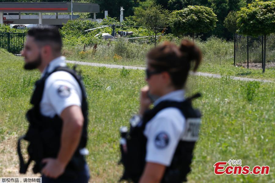 Photo taken on July 1, 2018 in Gonesse, north of Paris shows police near a French helicopter Alouette II abandoned by French armed robber Redoine Faid after his escape from prison in Reau. Redoine Faid was flown out of Réau prison with the help of three heavily-armed accomplices, security sources say. (Photo/Agencies)