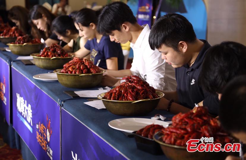 Participants compete in a recruitment fair to select crayfish tasters in Nanjing City, East China’s Jiangsu Province, July 1, 2018. The newly created position - crayfish taster - will have an annual salary of 500,000 yuan ($75,000). Crayfish is a popular dish in China. (Photo: China News Service/Li Ke)