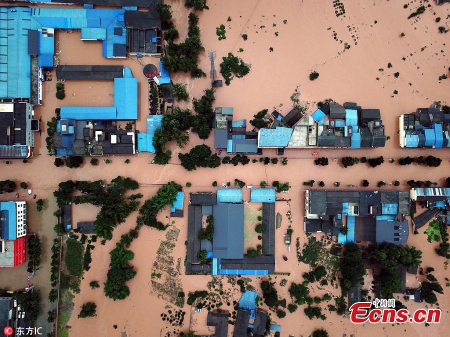 <?php echo strip_tags(addslashes(An aerial view of flooded areas in Shouan Town, Pujiang County, Southwest China’s Sichuan Province, July 2, 2018, after a rainstorm. (Photo/IC))) ?>