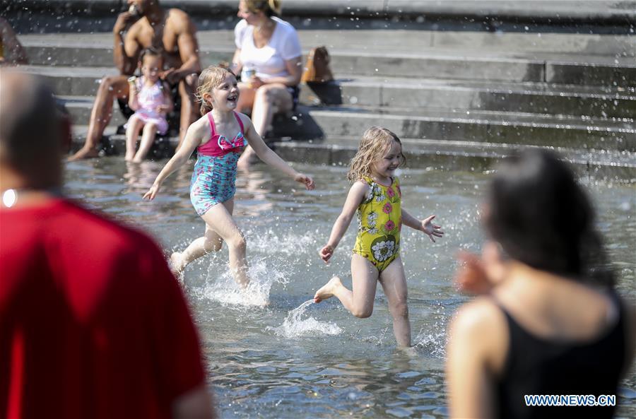 Girls play at a fountain at Washington Square Park in New York City, the United States, on July 2, 2018. The highest temperature reached 35 degrees Celsius in New York City on Monday as a result of a prolonged heat wave. (Xinhua/Wang Ying)
