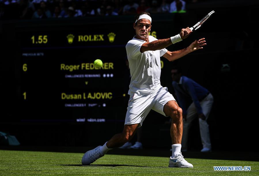 Roger Federer of Switzerland hits a return during the men\'s singles first round match against Dusan Lajovic of Serbia at the Championship Wimbledon 2018 in London, Britain, on July 2, 2018. Roger Federer won 3-0. (Xinhua/Tang Shi)