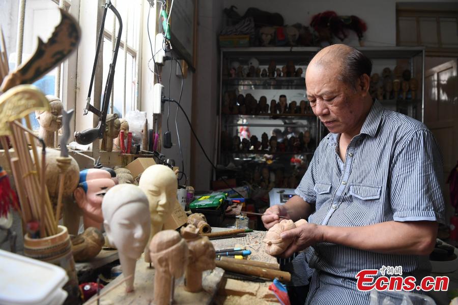<?php echo strip_tags(addslashes(Folk artist Yang Yazhou makes a puppet head in his studio in Zhangzhou City, East China’s Fujian Province, July 1, 2018. Zhangzhou has a history of puppetry going back more than two thousand years. Yang represents the fifth generation of his family to be involved with Fuchun-style glove puppets show, an intangible cultural heritage. He began learning to carve puppet heads when he was nine years old, taught by several masters. Yang said it takes tens of steps to finish carving a puppet-head in about three days. Yang’s sister specializes in dressing the puppets, his brother in puppet performance. (Photo: China News Service/Zhang Bin))) ?>