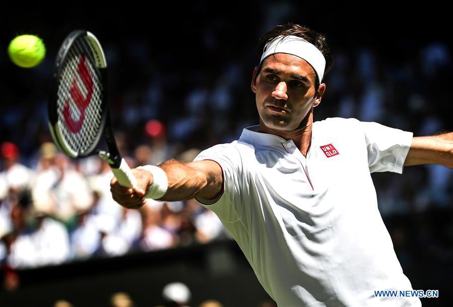Roger Federer of Switzerland hits a return during the men\'s singles first round match against Dusan Lajovic of Serbia at the Championship Wimbledon 2018 in London, Britain, on July 2, 2018. Roger Federer won 3-0. (Xinhua/Tang Shi)