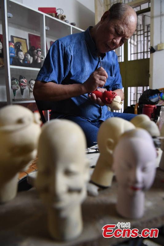 <?php echo strip_tags(addslashes(Folk artist Yang Yazhou paints the head of a puppet in his studio in Zhangzhou City, East China’s Fujian Province, July 1, 2018. Zhangzhou has a history of puppetry going back more than two thousand years. Yang represents the fifth generation of his family to be involved with Fuchun-style glove puppets show, an intangible cultural heritage. He began learning to carve puppet heads when he was nine years old, taught by several masters. Yang said it takes tens of steps to finish carving a puppet-head in about three days. Yang’s sister specializes in dressing the puppets, his brother in puppet performance. (Photo: China News Service/Zhang Bin))) ?>