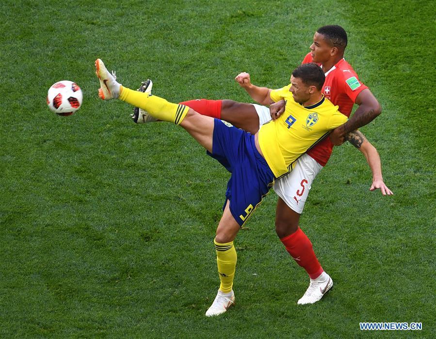 Manuel Akanji (top) of Switzerland vies with Marcus Berg of Sweden during the 2018 FIFA World Cup round of 16 match between Switzerland and Sweden in Saint Petersburg, Russia, July 3, 2018. (Xinhua/Wang Yuguo)