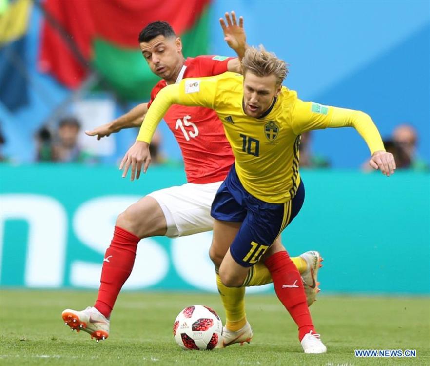 Blerim Dzemaili (L) of Switzerland vies with Emil Forsberg of Sweden during the 2018 FIFA World Cup round of 16 match between Switzerland and Sweden in Saint Petersburg, Russia, July 3, 2018. (Xinhua/Xu Zijian)