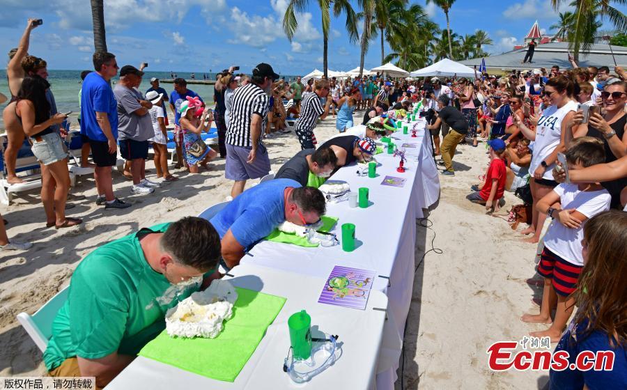 Photo taken on July 4, 2018 shows Trey Bergman, a lawyer of Houston, won Key West\'s annual Key lime pie eating contest for the second year in a row, scarfing down the signature Florida dessert in less than two minutes. Without using his hands, Trey Bergman defeated 24 other contenders for the title. Clad in protective googles and a \