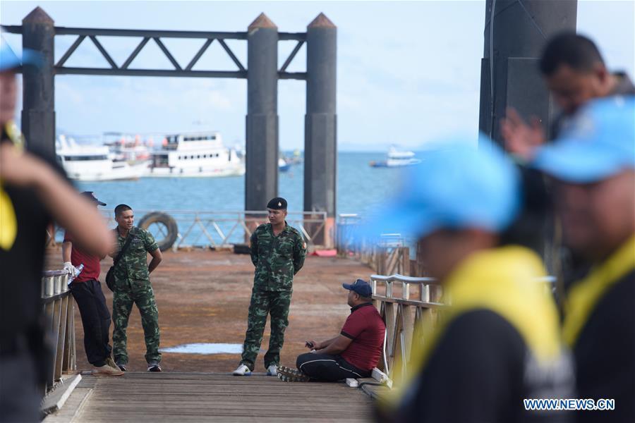 <?php echo strip_tags(addslashes(Thai soldiers and policemen are seen at a dock in Phuket, Thailand, July 6, 2018. At least 33 passengers were killed and 23 others still missing after two boats carrying some 133 tourists capsized in rough sea waters in southern Thailand, Governor of Thailand's Phuket Province Norraphat Plodthong said on Friday. (Xinhua/Qin Qing))) ?>