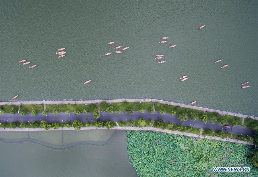 <?php echo strip_tags(addslashes(Aerial photo taken on July 6, 2018 shows the summer scenery of the West Lake in Hangzhou, east China's Zhejiang Province. (Xinhua/Xu Yu))) ?>