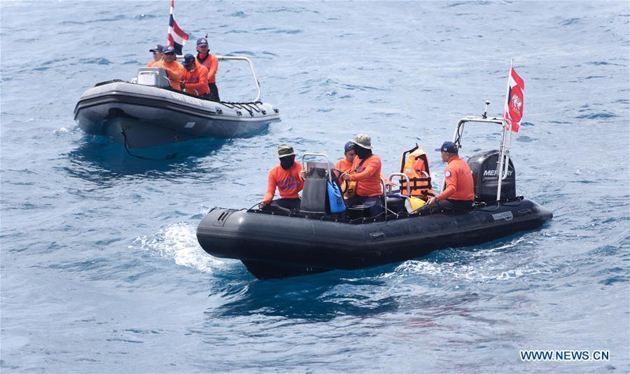 <?php echo strip_tags(addslashes(Members of Thai rescue team search for missing passengers from the capsized boat in the accident area in Phuket, Thailand, July 8, 2018. At least 42 people were confirmed dead and 14 others still missing after two boats capsized in a storm off southern Thailand's Phuket island, Thai officials said on Saturday. (Xinhua/Qin Qing))) ?>